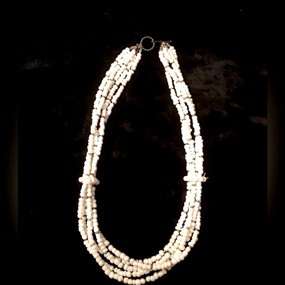 White and silver multi strand beads with easy toggle closure.